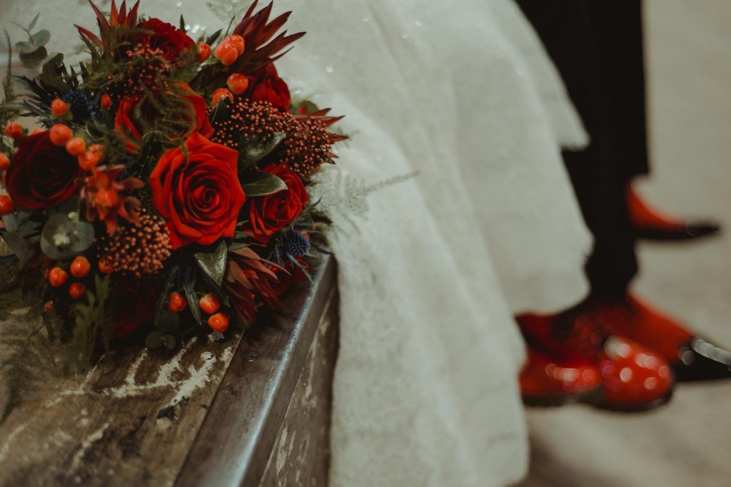 wedding bouquet and red shoes