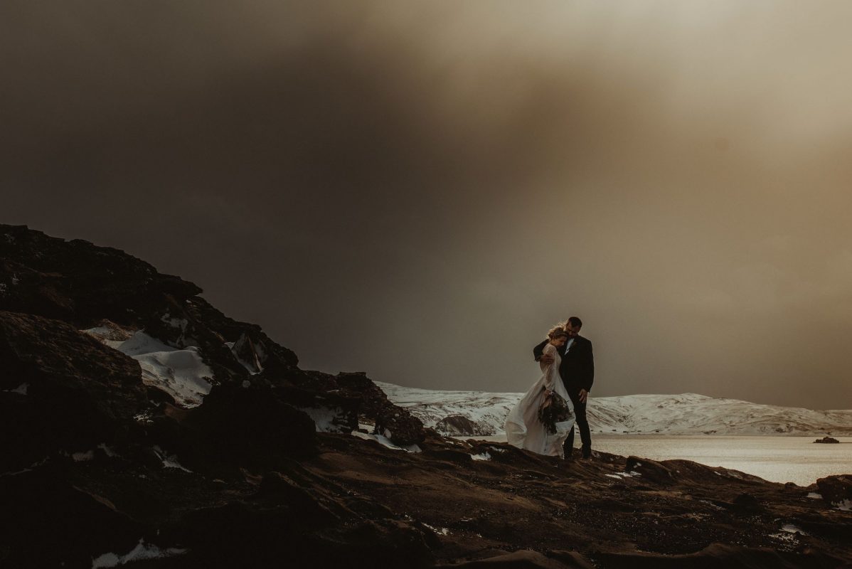 Iceland wedding couple posing by the lake
