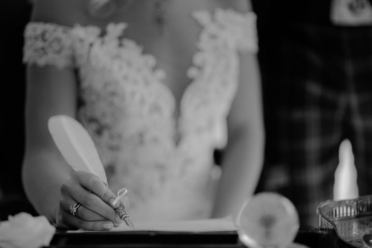Bride signing the wedding register at Elsick House